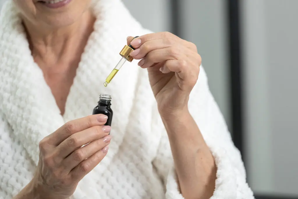 Elderly woman using essential oils