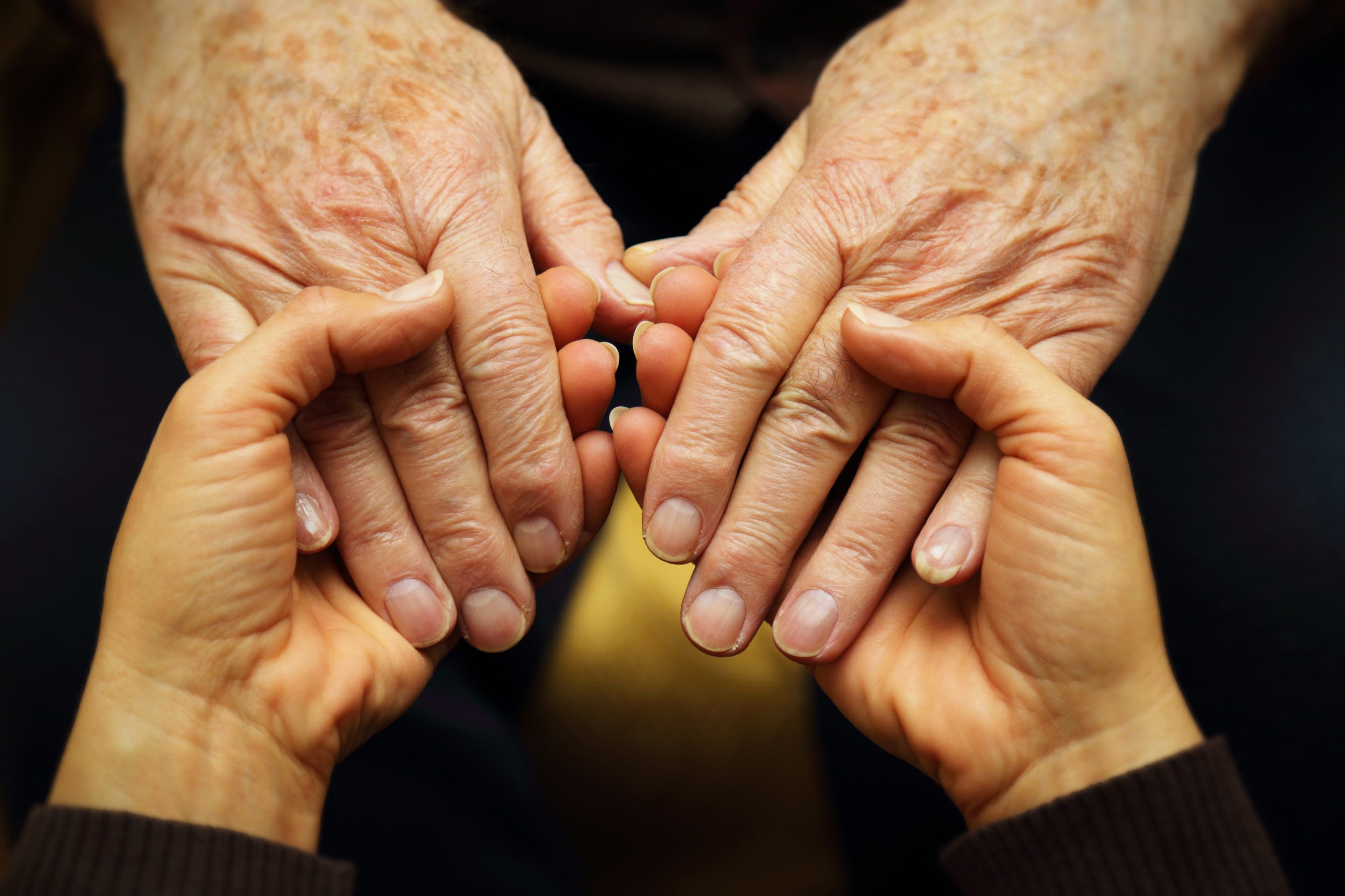 Seniors holding hands