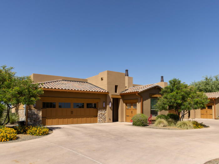 sagewood_1489 An exterior wide picture of a house near Sagewood in Phoenix, AZ. The image feature a beige colored house in a suburban neighborhood.
