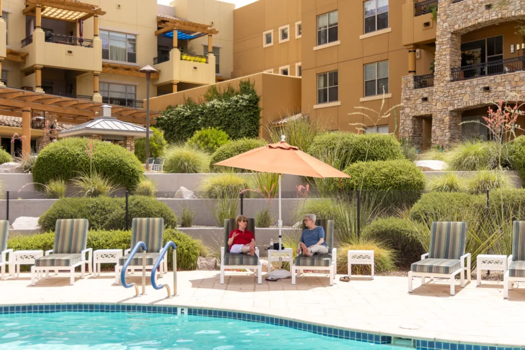 Two elderly women enjoying the amenities of carefree senior living at Sagewood in Phoenix, AZ.