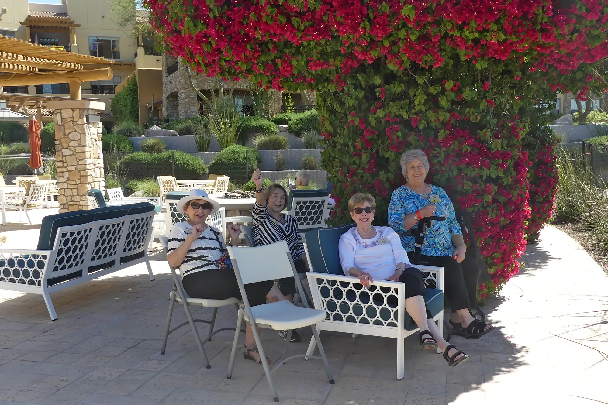 Group of Sagewood residents sitting outdoors in the gardens